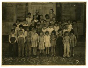[Photograph of Elementary Students by a School]