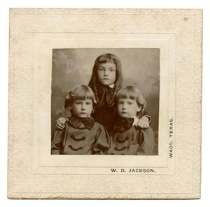 [Three Children Posing for a Photograph]
