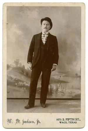 [Portrait of a Man Wearing a Suit and Hat]