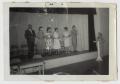 Photograph: [Photograph of a Group of Women on Stage]