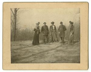 Primary view of object titled '[Photograph of a Group of Five People Amidst Trees]'.