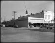 Photograph: C.R. Anthony Co. and Ira A. Prewitt Hardware buildings on street corn…