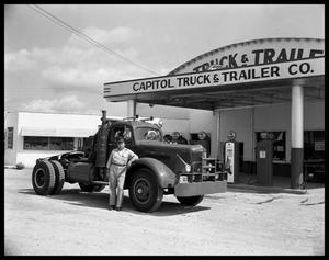 Man and truck standing in front of Capitol Truck & Trailer Co.