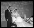 Photograph: Wallace Scott Jr. Wedding - Bride and Groom cut the cake
