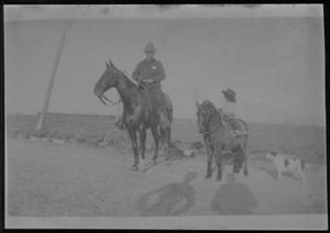 [Postcard image of a man on horseback and a  child on a pony]