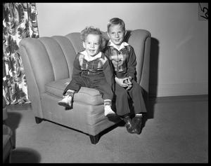 [Two Small Boys on Chair]