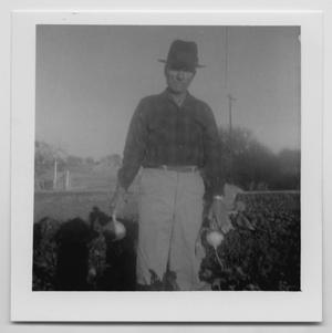 [Photograph of Oscar D. Back with Turnips]