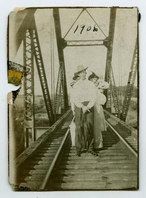 [Photograph of Friends Walking on the Rowlett Creek Railroad Bridge]
