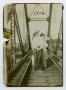 Photograph: [Photograph of Friends Walking on the Rowlett Creek Railroad Bridge]