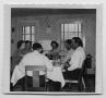 Primary view of [Photograph of Six Individuals at Dinner]