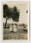 Photograph: [Photograph of a Woman with Three Children]