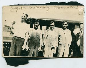 [Two Photographs of Oldsmobile Employees and a Galveston Dock]
