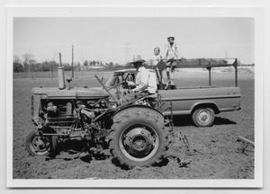 [Photograph of Oscar D. Back on a Tractor]