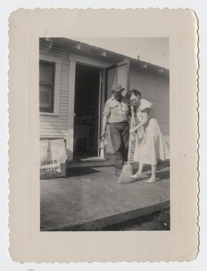 [Photograph of a Couple Cleaning the House]