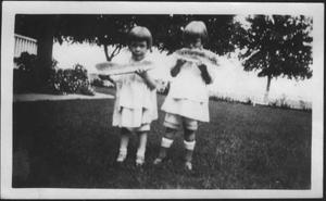 [Photograph of Mary Jones and another young girl eating watermelon]