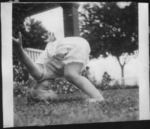 [Photograph of Mary Jones playing in the front yard of the George Ranch house]