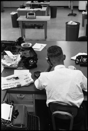 [Man Working at Desk at Beaumont Enterprise #20]