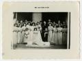 Thumbnail image of item number 1 in: '[Portrait of Bride and Groom Standing with Wedding Party]'.