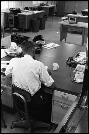 [Man Working at Desk at Beaumont Enterprise #21]