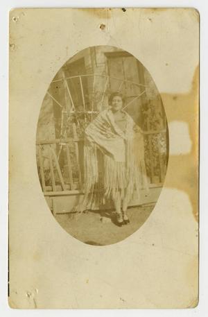 Primary view of object titled '[Photograph of Woman Posing in Front of a House]'.