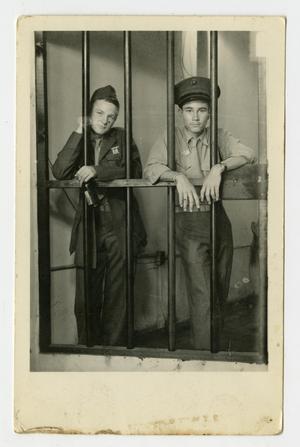 Primary view of object titled '[Photograph of Two Boys Posing Inside a Jail Cell]'.