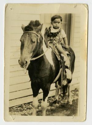 Primary view of object titled '[Photograph of a Boy on a Horse]'.