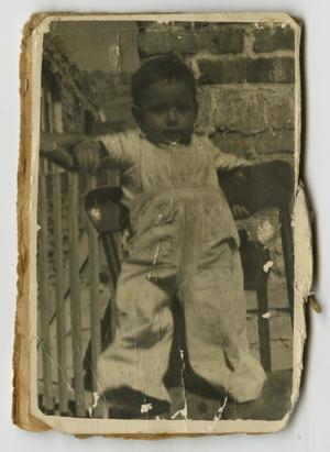 [Photograph of Infant Boy Standing on Chair]