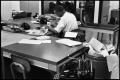 Photograph: [Man Working at Desk at Beaumont Enterprise #23]