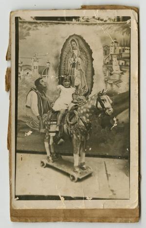 [Photograph of Small Girl Sitting on a Fake Horse]
