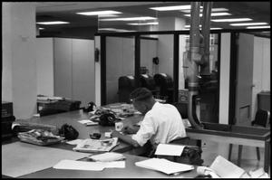 [Man Working at Desk at Beaumont Enterprise #28]