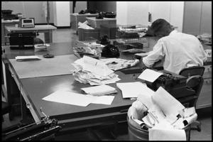 [Man Working at Desk at Beaumont Enterprise #6]