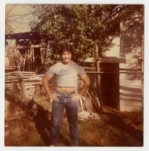 Primary view of object titled '[Photograph of a Man Standing in a Yard]'.