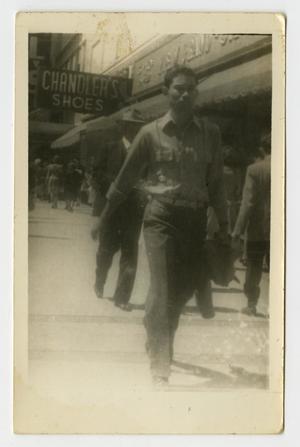 Primary view of object titled '[Photograph of Young Man Walking]'.