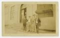 Photograph: [Four Men in Front of Building]