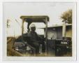 Photograph: [Man Sitting in Construction Vehicle]