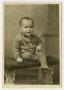 Thumbnail image of item number 1 in: '[Portrait of Small Male Child Sitting on a Bench]'.