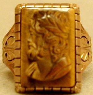 [Copper ring with a rectangular carved stone]