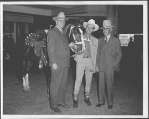 [Albert Peyton George, Gene Autry, and Virgil Shepherd standing next to a horse]