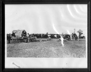 [Albert Peyton George with ranch cowboys taking a break at the chuck wagon]