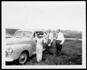 [Mrs. Steward, Mr. A. P. George, Judge Elkins standing next to an automobile]