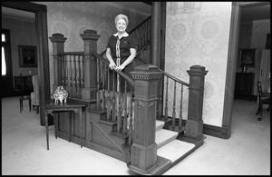 [Woman Poses on Decorative Staircase]