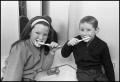 Photograph: [Girl and Boy Brushing Their Teeth]