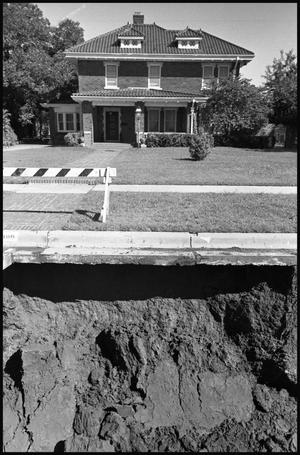 [House in Front of Drainage Ditch Under Construction]