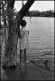 Photograph: [Young Girl Standing at Lakes Edge]