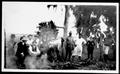 Thumbnail image of item number 1 in: '[Group of men near an underground barbecue pit at Camp George]'.