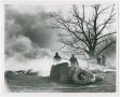 Photograph: [Firefighters Hosing Down Burning Tires]