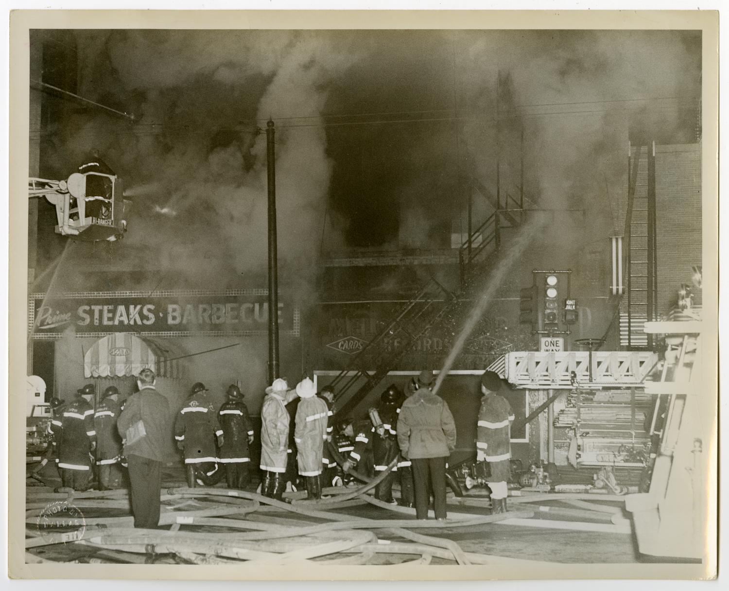 [Row of Firefighters in Front of Smoking Building]
                                                
                                                    [Sequence #]: 1 of 2
                                                