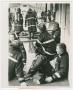 Photograph: [Firefighters Sitting and Standing After Firefighting]