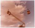 Thumbnail image of item number 1 in: '[Aerial Lift Crane Reaching Towards Sky Tram Car]'.