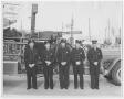 Photograph: [Firefighters Stand in Front of Fire Engine]